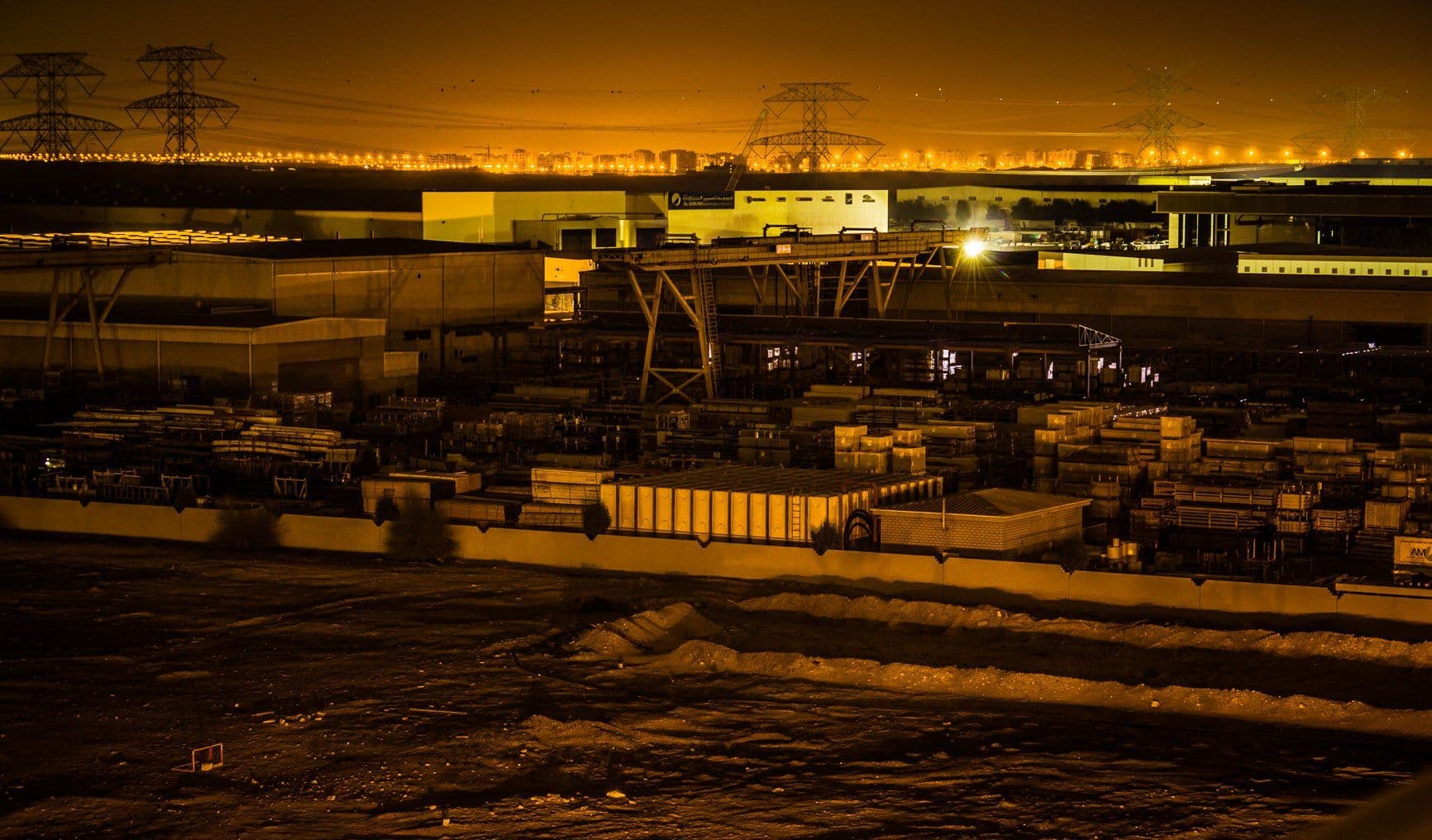 Jebel Ali port and container yards lit up at night in Dubai